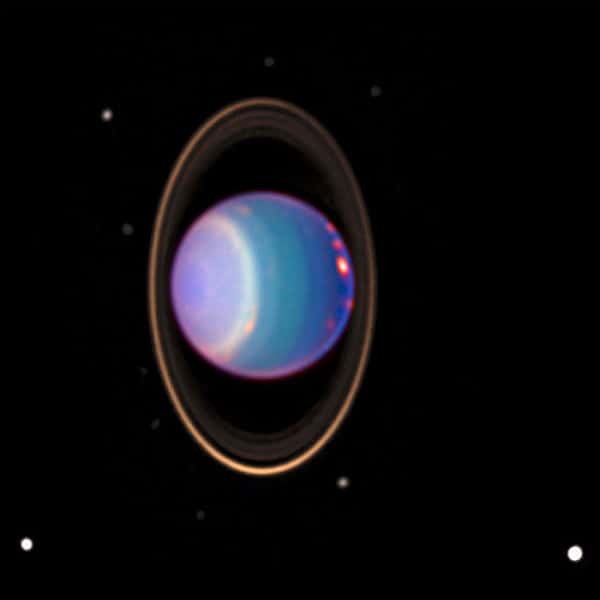 Immagine di Urano e del suo sistema di anelli e di satelliti, ripresi dal Telescopio Spaziale Hubble, nel 1997.